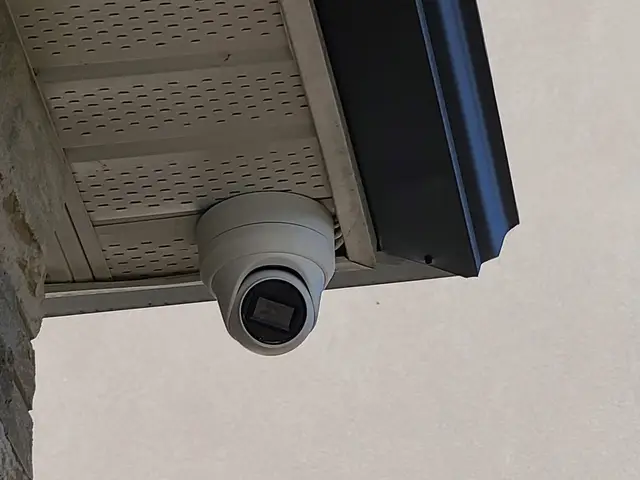 Turret camera under the soffit of a two-storey home