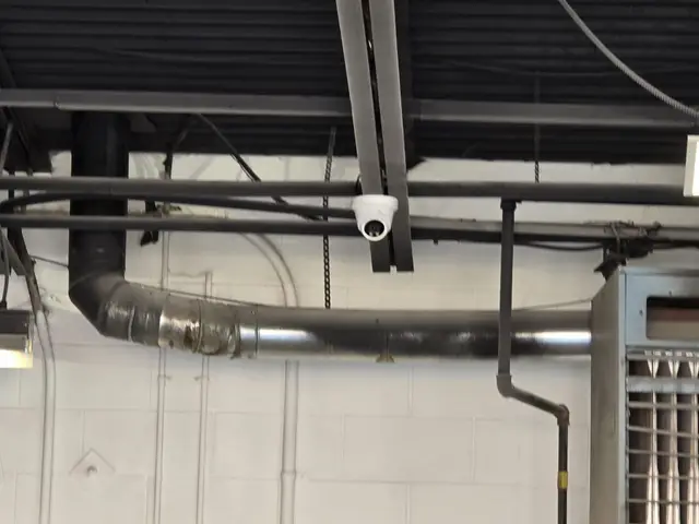 Camera on the exposed ceiling of a commercial unit